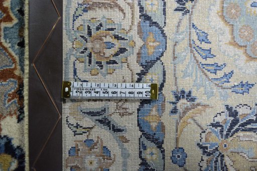 Backside of handmade 1950s Kashan rug showing knot structure and weave density