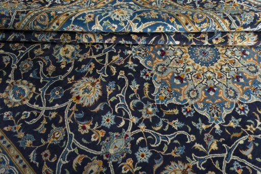 Close-up detail of 2000s Kashan rug from Iran / Persia showing Wool weave
