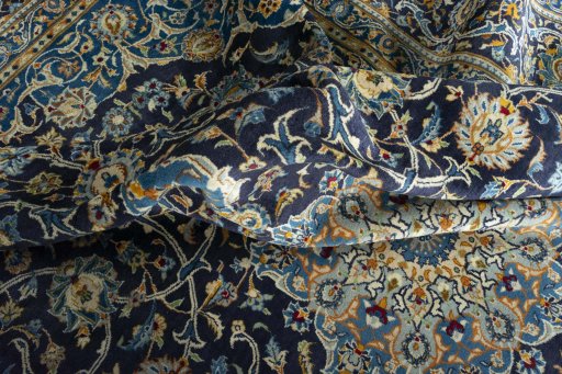 Surface texture of 2000s Kashan rug with natural Wool and intricate pattern