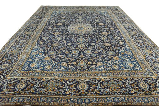 Surface texture of 2000s Kashan rug with natural Wool and intricate pattern