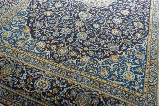 Close-up detail of 2000s Kashan rug from Iran / Persia showing Wool weave