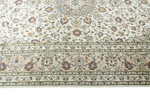 Corner detail of 2000s Kashan rug showing border pattern and Wool pile