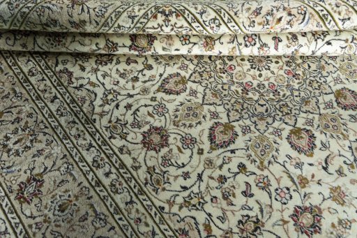 Close-up detail of 2000s Kashan rug from Iran / Persia showing Wool weave