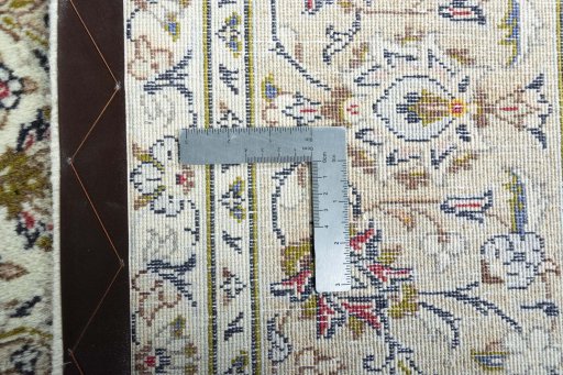 Backside of handmade 2000s Kashan rug showing knot structure and weave density