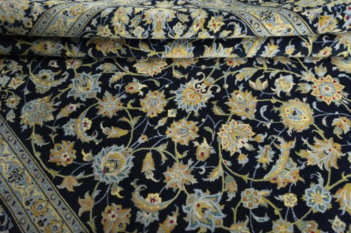 Close-up detail of 2000s Kashan rug from Iran / Persia showing Wool weave