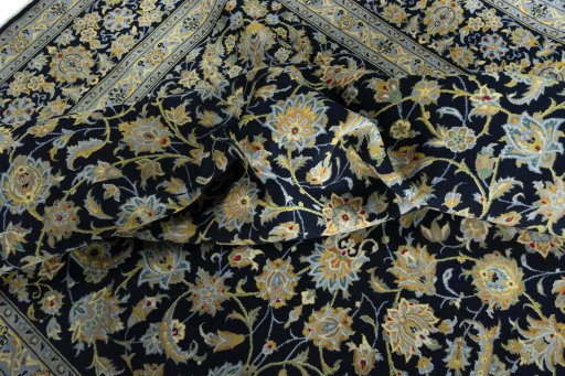 Surface texture of 2000s Kashan rug with natural Wool and intricate pattern