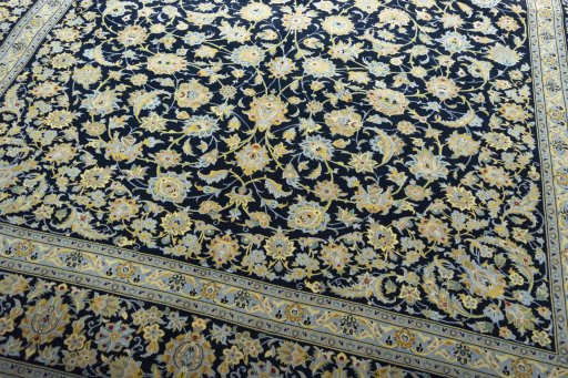Close-up detail of 2000s Kashan rug from Iran / Persia showing Wool weave