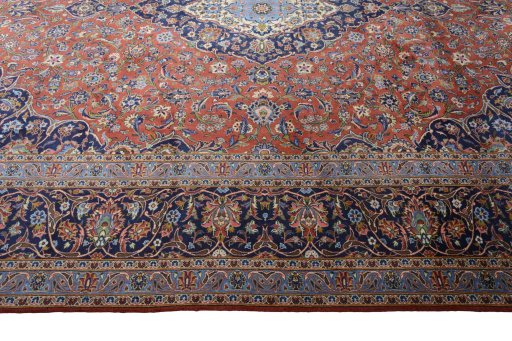 Corner detail of New Kashan rug showing border pattern and Cork pile