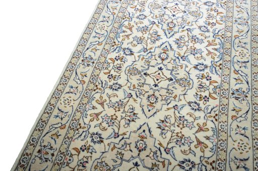 Backside of handmade 2000s Kashan rug showing knot structure and weave density