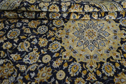 Close-up detail of 2000s Kashan rug from Iran / Persia showing Wool weave