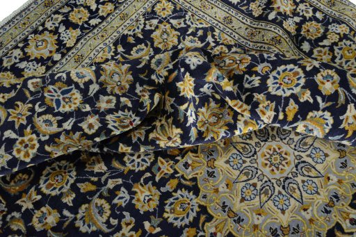 Surface texture of 2000s Kashan rug with natural Wool and intricate pattern
