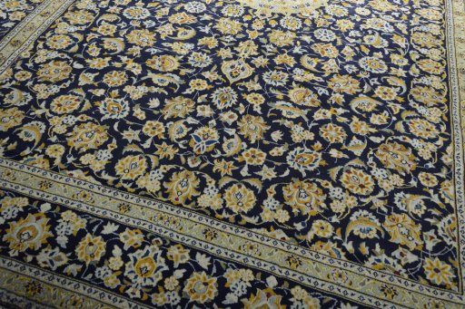 Close-up detail of 2000s Kashan rug from Iran / Persia showing Wool weave