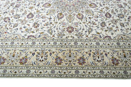 Corner detail of 2000s Kashan rug showing border pattern and Wool pile