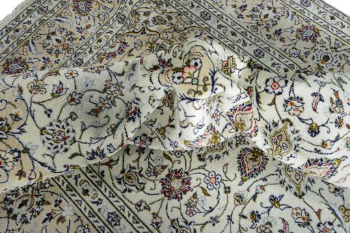Surface texture of 2000s Kashan rug with natural Wool and intricate pattern