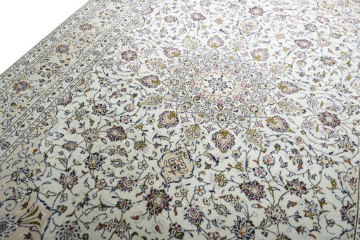 Backside of handmade 2000s Kashan rug showing knot structure and weave density
