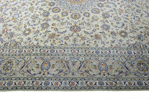 Corner detail of 2000s Kashan rug showing border pattern and Wool pile