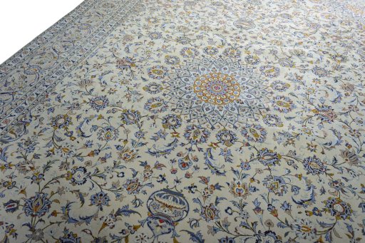 Backside of handmade 2000s Kashan rug showing knot structure and weave density