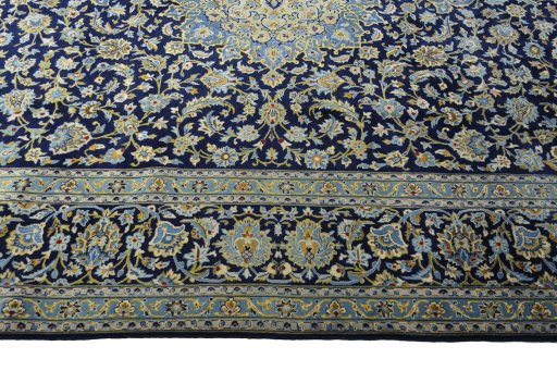 Corner detail of 2000s Kashan rug showing border pattern and Wool pile