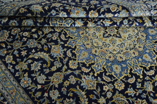 Close-up detail of 2000s Kashan rug from Iran / Persia showing Wool weave