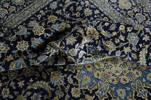 Surface texture of 2000s Kashan rug with natural Wool and intricate pattern
