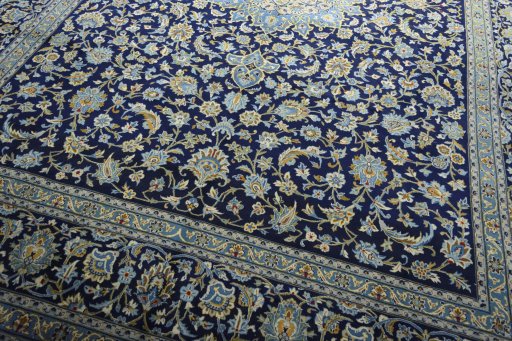 Close-up detail of 2000s Kashan rug from Iran / Persia showing Wool weave