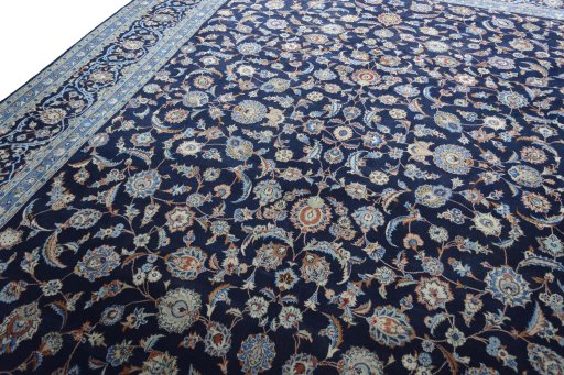 Backside of handmade 2000s Kashan rug showing knot structure and weave density