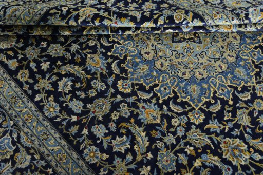 Close-up detail of 2000s Kashan rug from Iran / Persia showing Wool weave