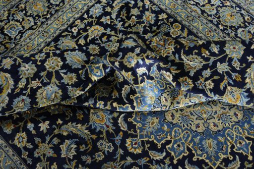 Surface texture of 2000s Kashan rug with natural Wool and intricate pattern