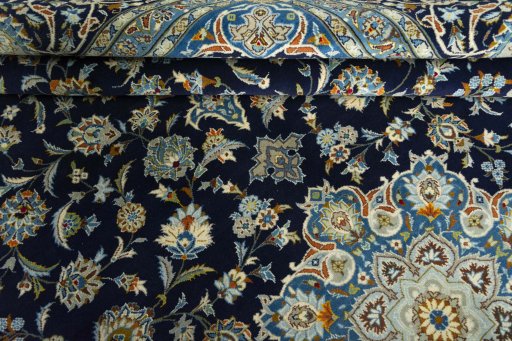 Close-up detail of 2000s Kashan rug from Iran / Persia showing Wool weave