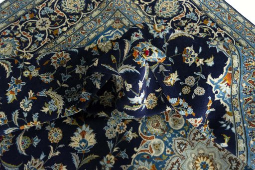 Surface texture of 2000s Kashan rug with natural Wool and intricate pattern