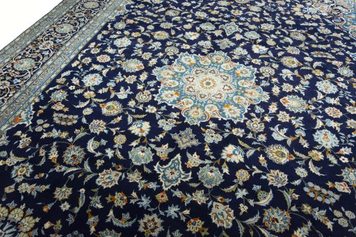 Backside of handmade 2000s Kashan rug showing knot structure and weave density