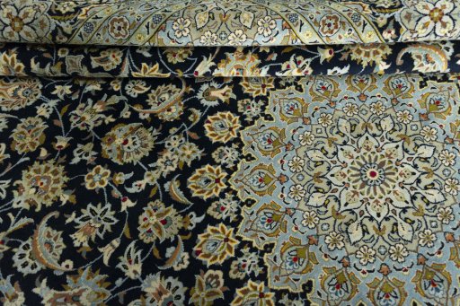 Close-up detail of 2000s Kashan rug from Iran / Persia showing Wool weave
