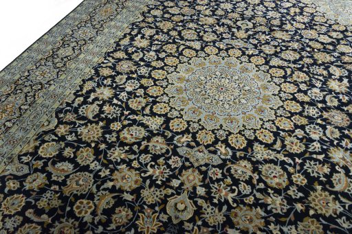 Backside of handmade 2000s Kashan rug showing knot structure and weave density