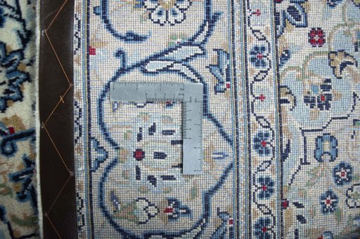 Backside of handmade 2000s Kashan rug showing knot structure and weave density