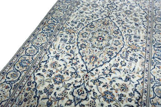 Backside of handmade 2000s Kashan rug showing knot structure and weave density