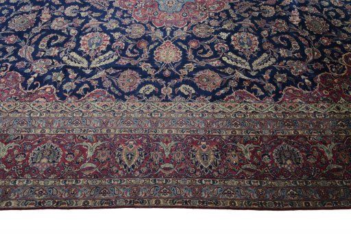 Corner detail of 1930s Kashan rug showing border pattern and Wool pile