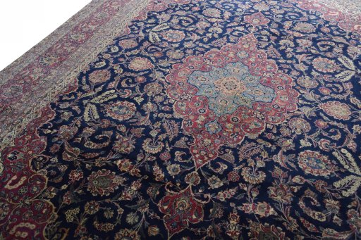 Backside of handmade 1930s Kashan rug showing knot structure and weave density
