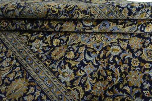 Close-up detail of 2000s Kashan rug from Iran / Persia showing Wool weave