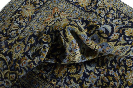 Surface texture of 2000s Kashan rug with natural Wool and intricate pattern