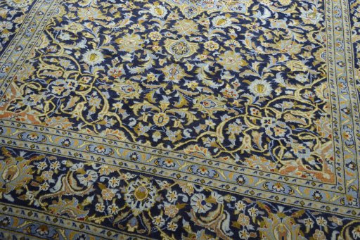 Close-up detail of 2000s Kashan rug from Iran / Persia showing Wool weave