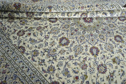 Close-up detail of 2000s Kashan rug from Iran / Persia showing Wool weave