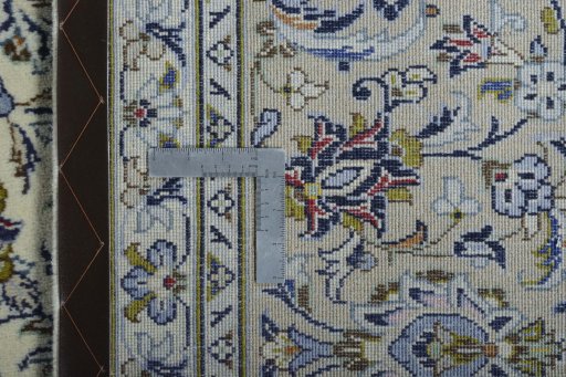 Backside of handmade 2000s Kashan rug showing knot structure and weave density
