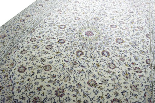 Backside of handmade 2000s Kashan rug showing knot structure and weave density