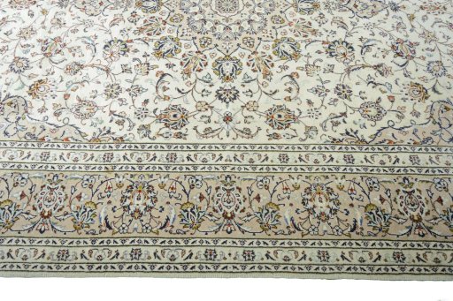 Corner detail of 2000s Kashan rug showing border pattern and Wool pile
