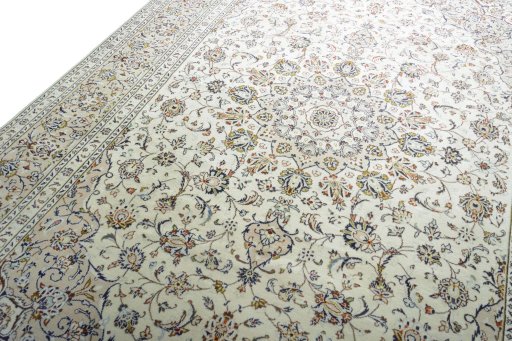 Backside of handmade 2000s Kashan rug showing knot structure and weave density