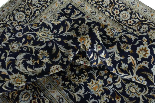 Surface texture of 2000s Kashan rug with natural Wool and intricate pattern