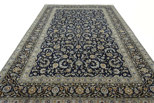 Surface texture of 2000s Kashan rug with natural Wool and intricate pattern