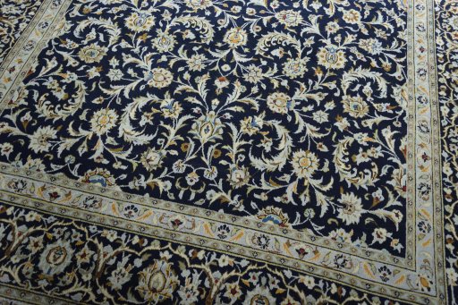 Close-up detail of 2000s Kashan rug from Iran / Persia showing Wool weave