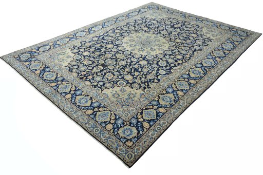 Corner detail of 2000s Kashan rug showing border pattern and Wool pile