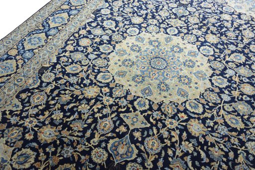 Backside of handmade 2000s Kashan rug showing knot structure and weave density